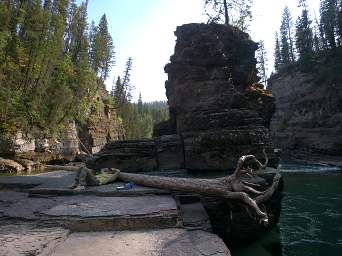 Wayne Resting By Rock Pillar